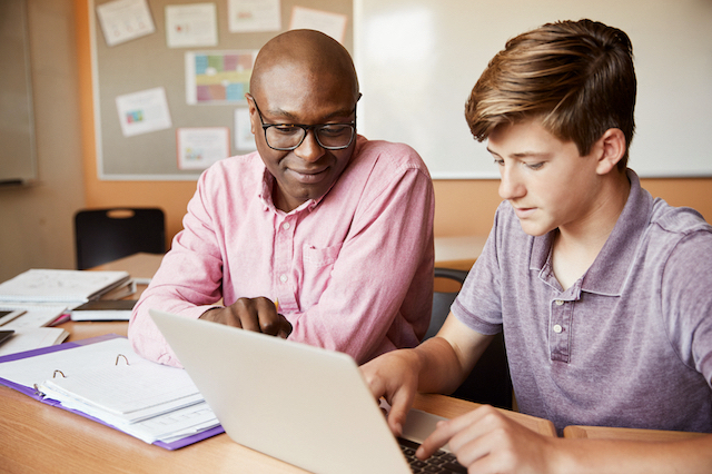 Tutor teaching a student